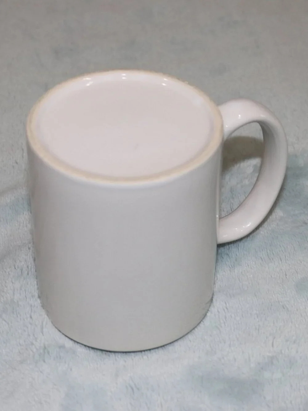White and green coffee mug.